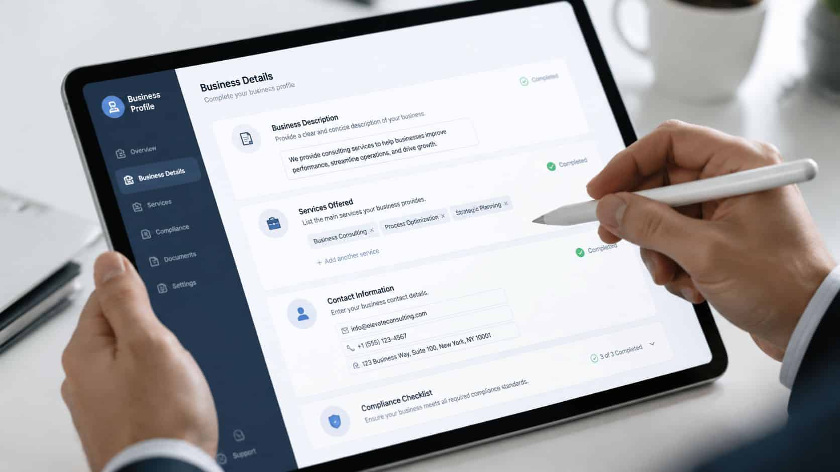 A professional using a digital tablet to update business details in an online profile management dashboard.