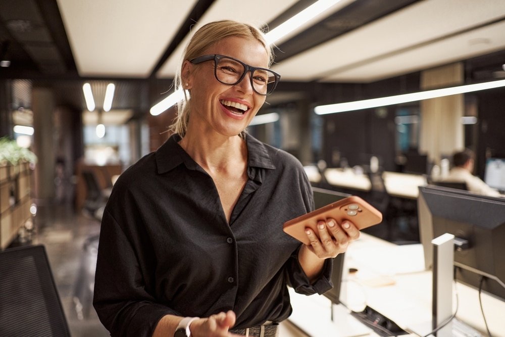 A,Smiling,Professional,Woman,Working,In,A,Modern,Office,Space