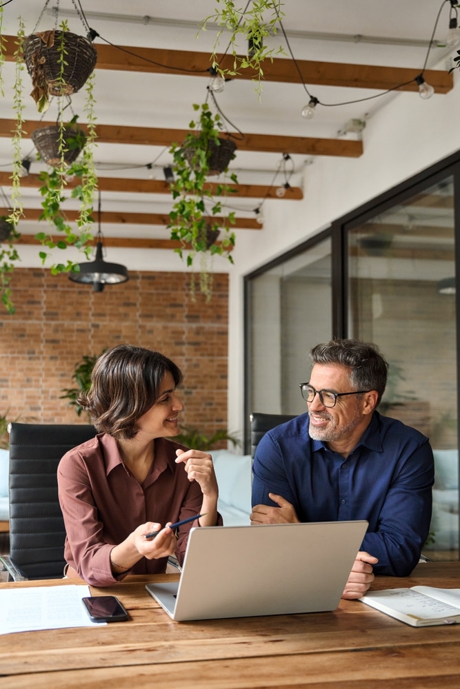 Two,Busy,Business,Team,People,Using,Laptop,Computer,Working,Together